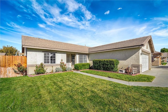 ranch-style home featuring a front yard and a garage