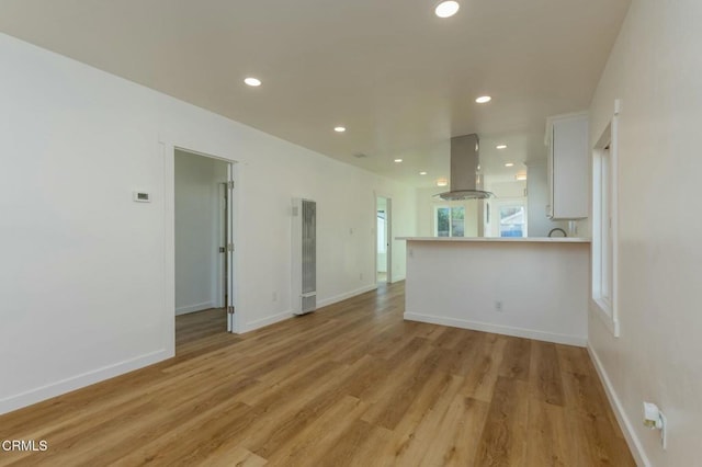 unfurnished living room featuring light hardwood / wood-style floors