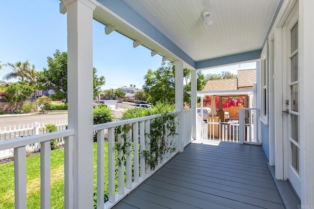 wooden terrace with a porch