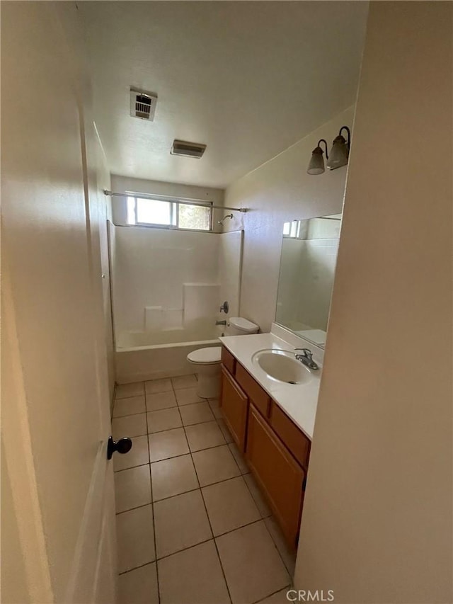 full bathroom with toilet, vanity, tile patterned flooring, and shower / washtub combination