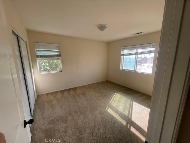 view of carpeted spare room