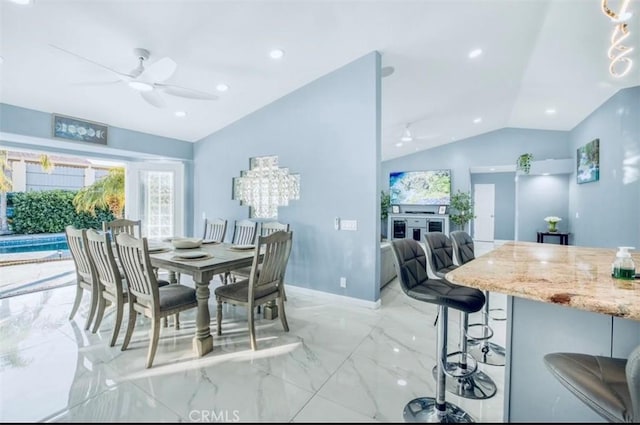 dining room with vaulted ceiling and ceiling fan