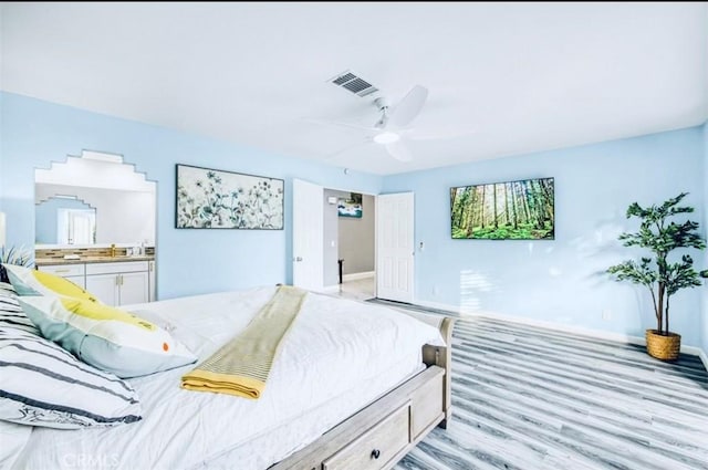 bedroom with ceiling fan and light hardwood / wood-style floors