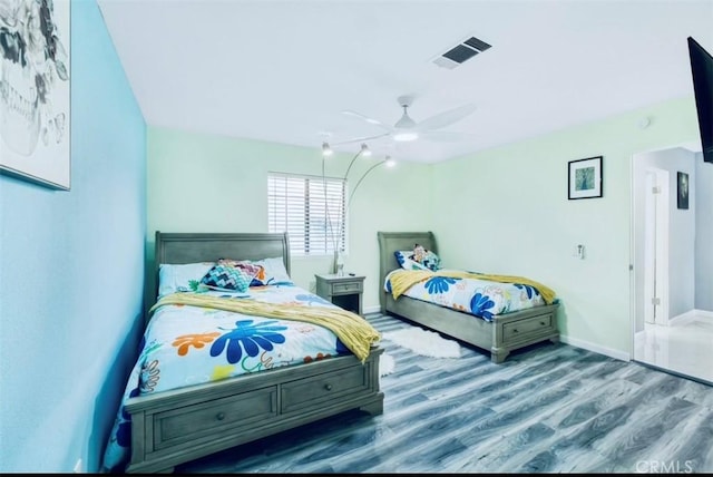 bedroom featuring hardwood / wood-style floors and ceiling fan