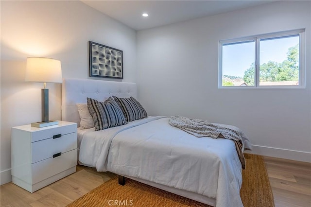 bedroom with light wood-type flooring