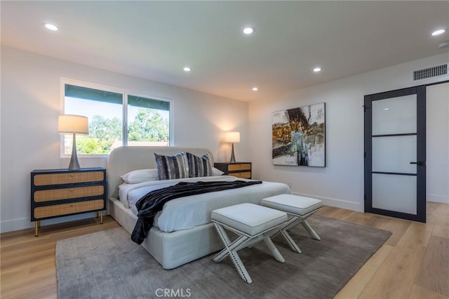 bedroom with light wood-type flooring