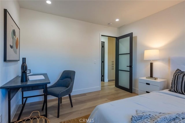 bedroom with light hardwood / wood-style flooring