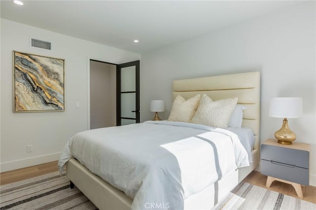 bedroom with light hardwood / wood-style flooring