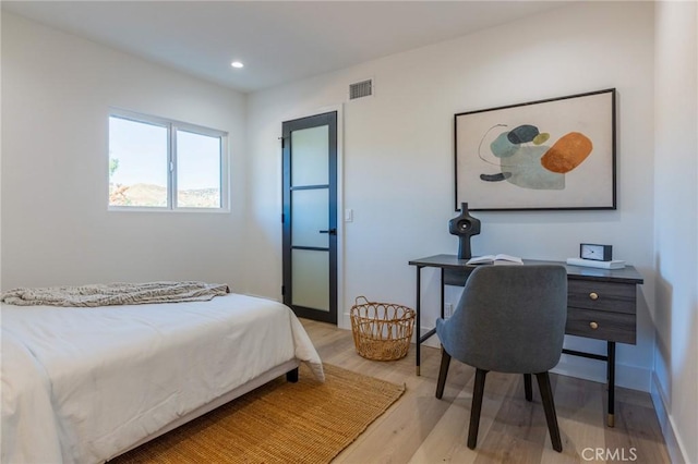 bedroom with light hardwood / wood-style floors