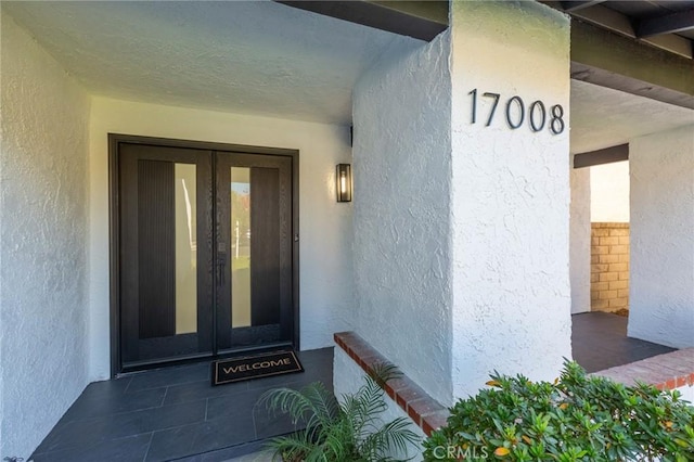 doorway to property featuring french doors