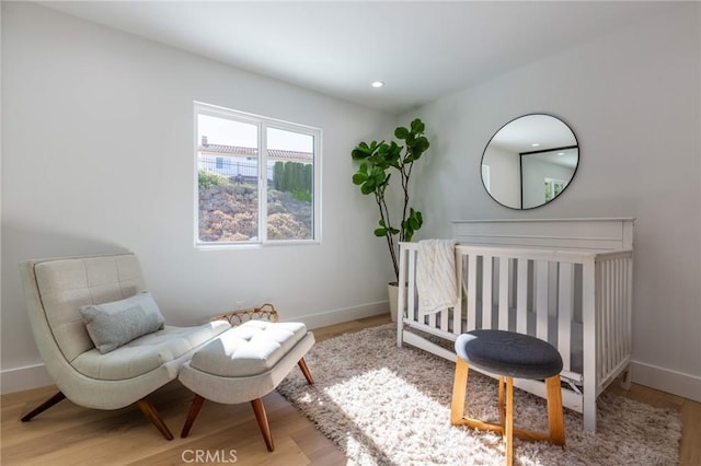 living area with light hardwood / wood-style floors