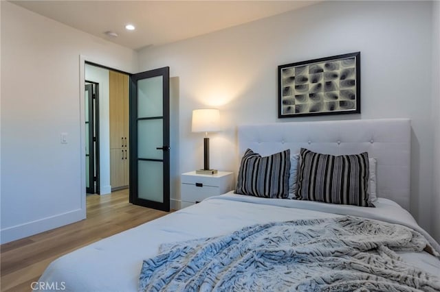 bedroom featuring light wood-type flooring