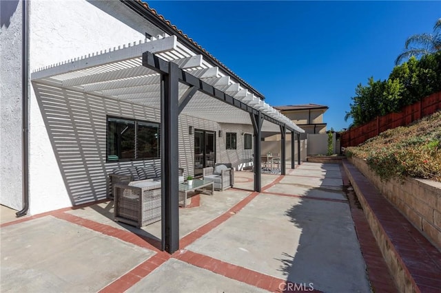 view of patio with a pergola and an outdoor living space