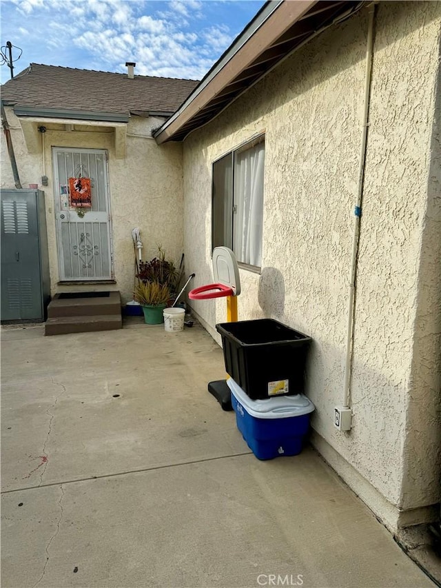 doorway to property with a patio