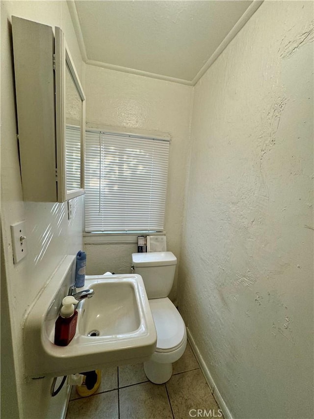 bathroom featuring tile patterned floors, sink, and toilet