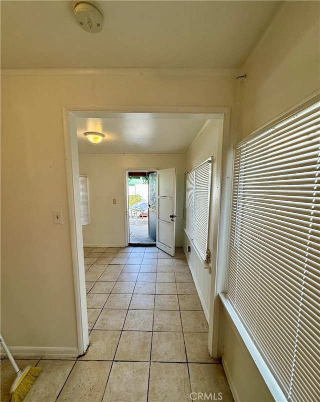 doorway to outside featuring light tile patterned floors