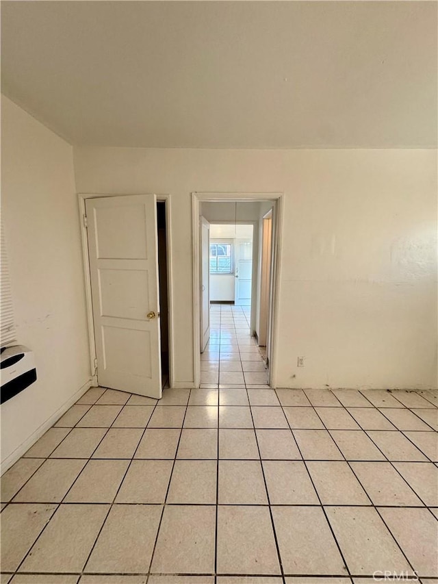 corridor with light tile patterned flooring