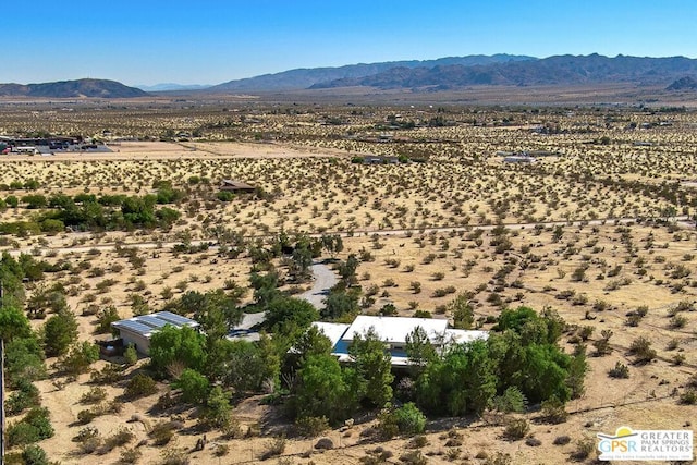 birds eye view of property with a mountain view