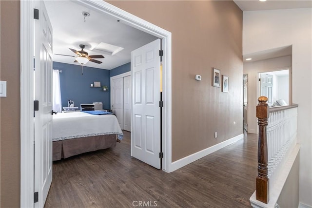 bedroom with ceiling fan, dark hardwood / wood-style floors, and a closet