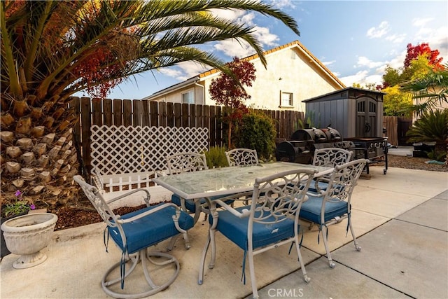 view of patio / terrace with a storage shed