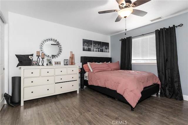 bedroom featuring ceiling fan and dark hardwood / wood-style flooring