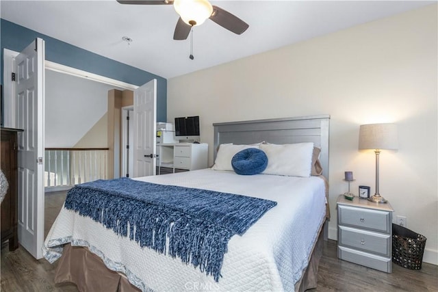 bedroom featuring ceiling fan and dark wood-type flooring