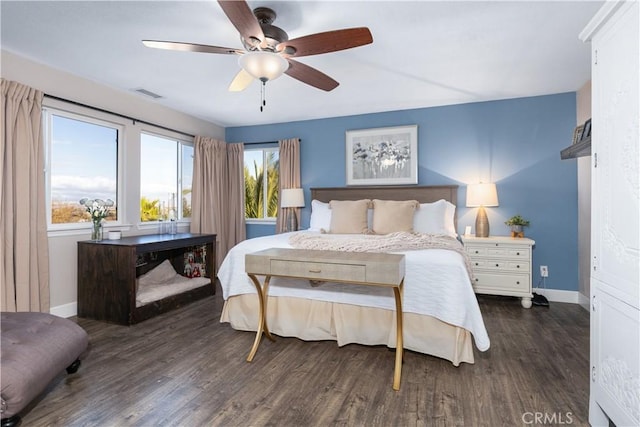 bedroom with ceiling fan and dark hardwood / wood-style floors