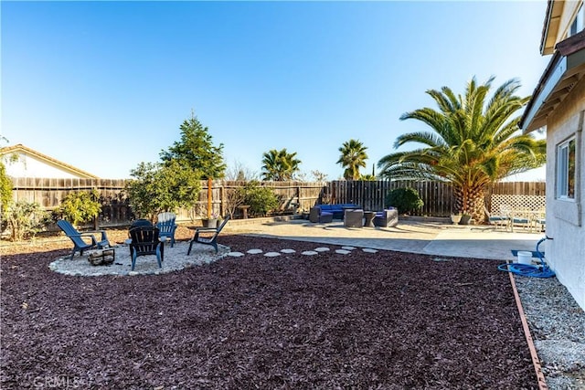 view of yard with an outdoor fire pit and a patio area