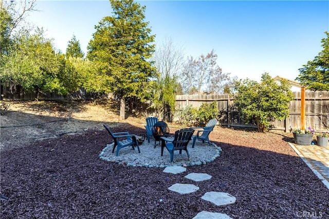 view of yard with an outdoor fire pit