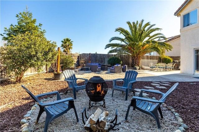 view of patio with an outdoor fire pit