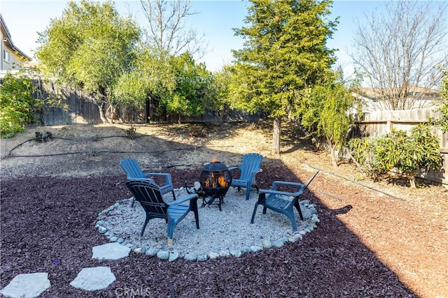 view of yard with an outdoor fire pit