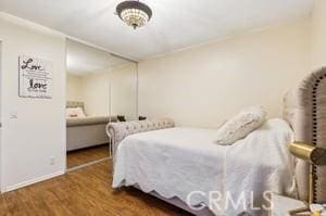 bedroom with hardwood / wood-style floors