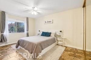 bedroom featuring ceiling fan