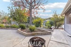 view of patio / terrace with a fire pit