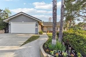 ranch-style home featuring a garage