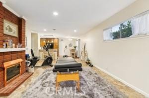 workout room with a fireplace