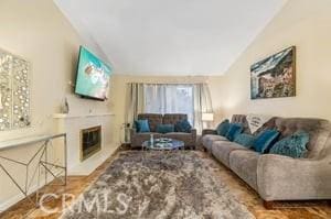 living room featuring vaulted ceiling