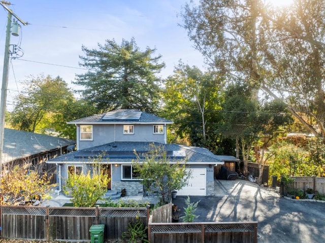 rear view of house with a garage