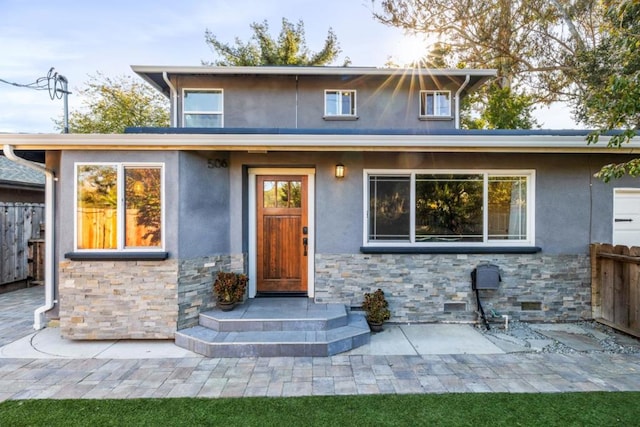 view of front of home featuring a patio