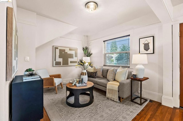 living room with dark hardwood / wood-style floors