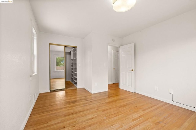 unfurnished room with light hardwood / wood-style flooring