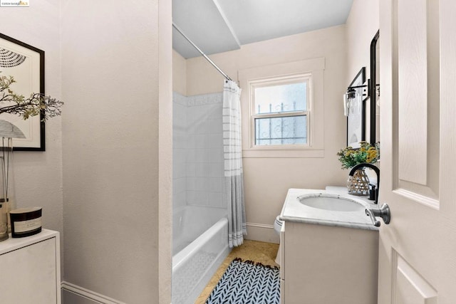 bathroom featuring tile patterned flooring, vanity, and shower / bathtub combination with curtain