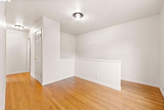 unfurnished room featuring light wood-type flooring