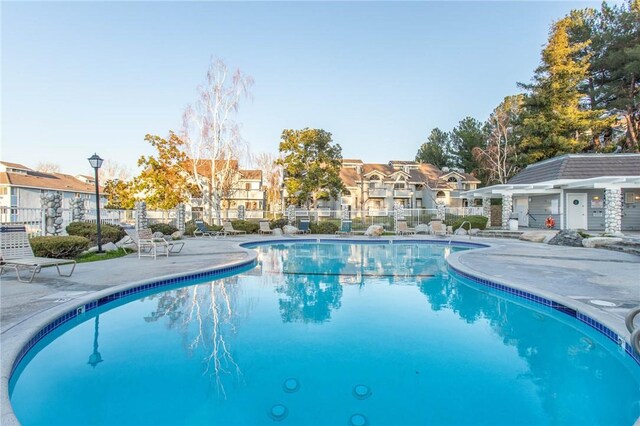 view of swimming pool featuring a patio area