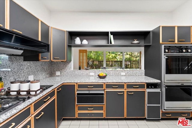 kitchen featuring stainless steel double oven, backsplash, black cooktop, extractor fan, and light tile patterned floors