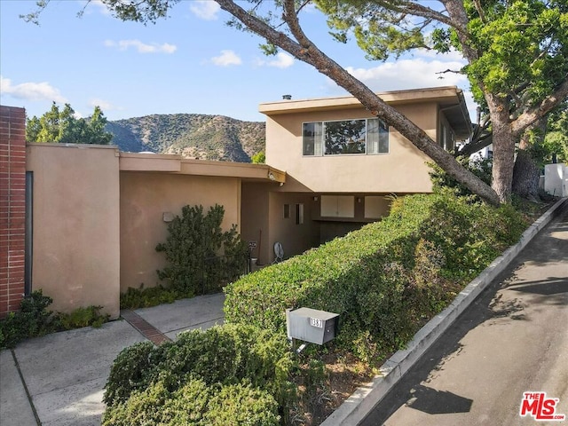 view of front of home featuring a mountain view