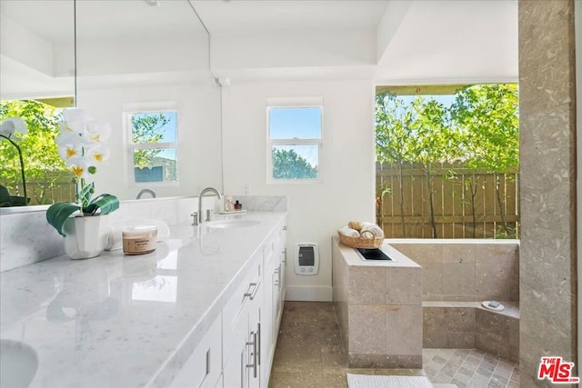 bathroom featuring vanity and heating unit