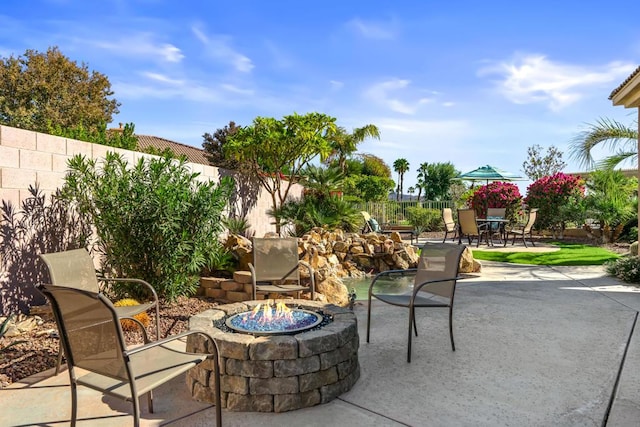 view of patio featuring a fire pit