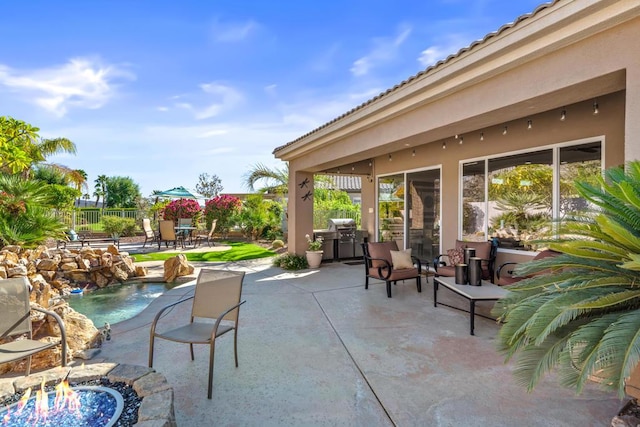 view of patio with pool water feature