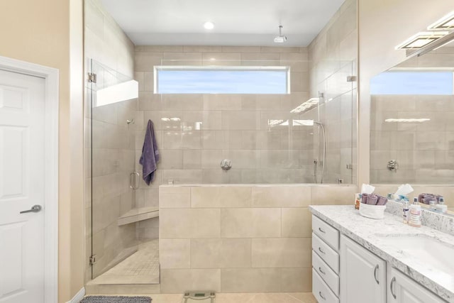 bathroom with tile patterned flooring, vanity, and an enclosed shower